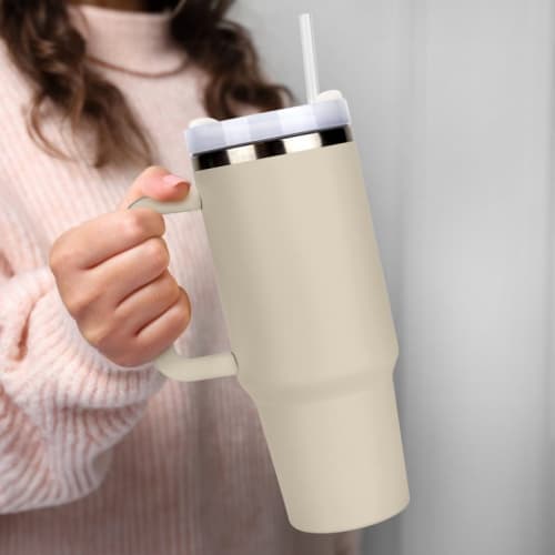 Promotional 1.2 Litre Extra Large Tumbler with Straw and Handle in Beige Being Held by Someone