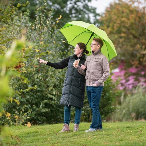 Lifestyle image of the Recycled Ökobrella Umbrella with Wooden Handle from Total Merchandise