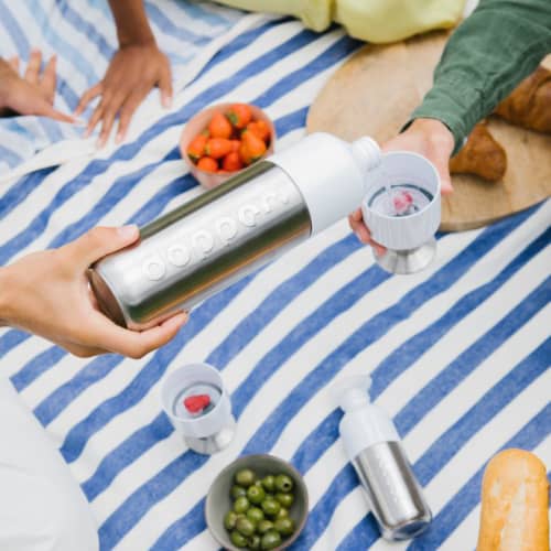 Lifestyle image of the 490ml Stainless Steel Dopper Bottle from Total Merchandise