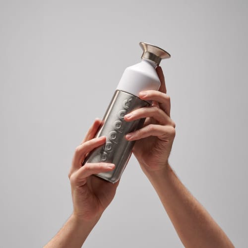 Lifestyle image of the 490ml Stainless Steel Dopper Bottle from Total Merchandise