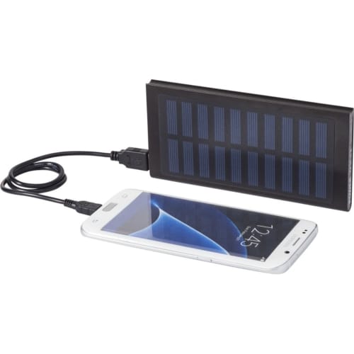 A lifestyle image to show the Stellar 8000mAh Solar Powerbank charging a phone