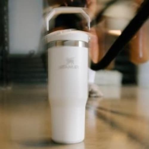 Lifestyle image of the Stanley 890ml IceFlow™ Flip Straw Tumbler with a design from Total Merchandise