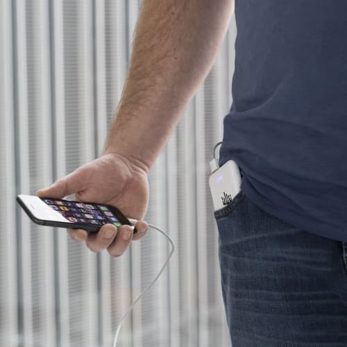 Lifestyle image of the 5000mAh RCS Recycled Pocket Powerbank in Black from Total Merchandise