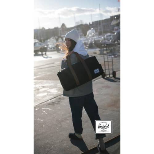 Lifestyle image of the Herschel Novel™ Recycled Duffle Bag from Total Merchandise