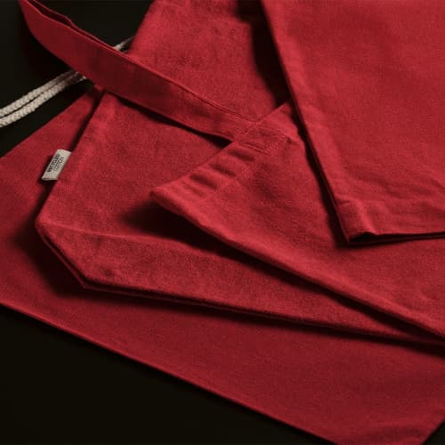 Lifestyle image of the Branded Handle Recycled Tote Bag in Red from Total Merchandise