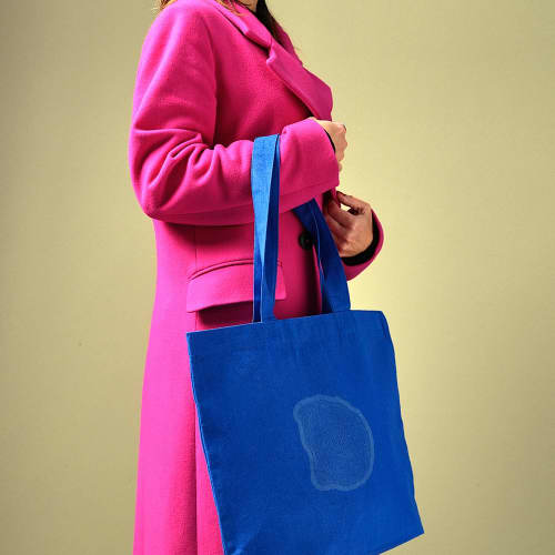 Lifestyle image of the Branded Handle Recycled Tote Bag in Royal Blue from Total Merchandise