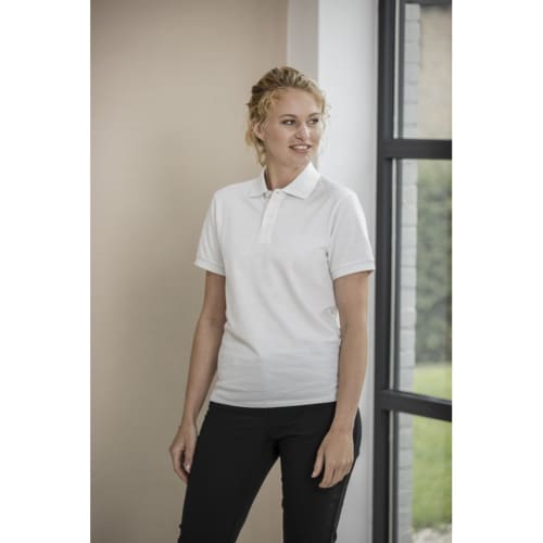 Lifestyle image of the Emerald Short Sleeve Unisex Aware™ Recycled Polo Shirt
