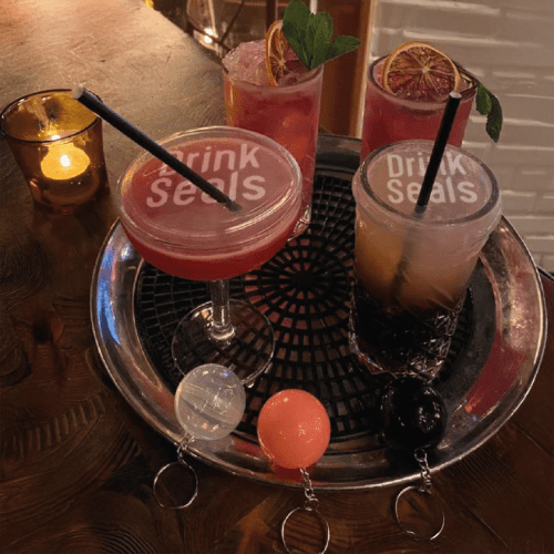 Tray of Drinks with Anti Spiking Drink Protectors Printed with a Logo by Total Merchandise
