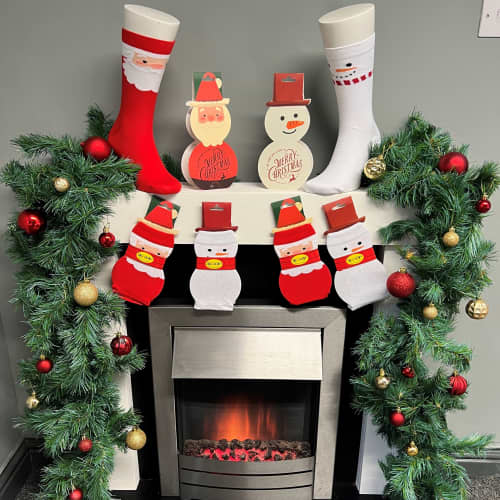 Lifestyle image of the Christmas Socks with Christmas Card in White from Total Merchandise