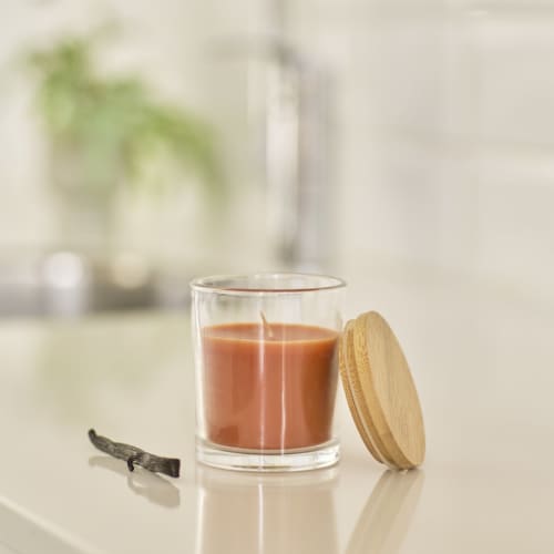 Lifestyle image of the Glass Candle in branded with your logo from Total Merchandise