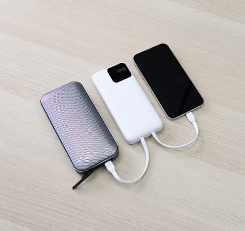 Lifestyle image of the BrandCharger 10,000mAh Eco Powerbank in White from Total Merchandise