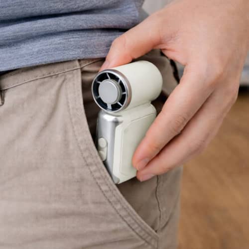 Lifestyle image of the Mini Cooling Ice Fan from Total Merchandise