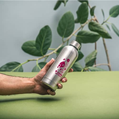 lifestyle image of the 550ml Recycled Stainless Steel Bottle with a design from Total Merchandise