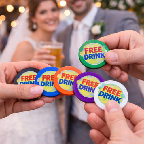 Lifestyle image of the 24mm Drinks Token customised with your company logo from Total Merchandise