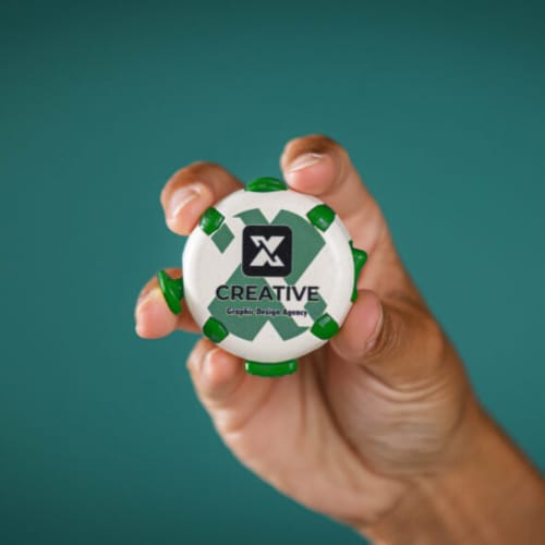 Lifestyle image of the logo printed Fidget Puck by Total Merchandise