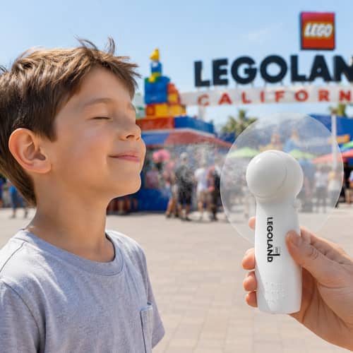 Lifestyle image of the Hand Held Fan personalised on the handle by Total Merchandise