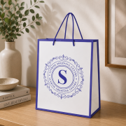Lifestyle image of the Newquay Glossy Medium Paper Bags by Total Merchandise