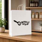 Lifestyle image of the Extra Large White Brunswick Paper Bags by Total Merchandise