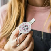 Lifestyle image of the Recycled Plastic Whistle Keychains with a design from Total Merchandise