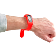Silicone Wristband Pedometers in red on a hand by Total Merchandise