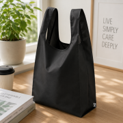 Lifestyle image of the rPET Vest Style Foldable Shopper Bag by Total Merchandise