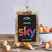 Promotional Large Popcorn Bag with Sticker on a table with popcorn around by Total Merchandise