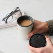 Lifestyle image of the Circular & Co 8oz Reusable Coffee Cup in Black branded with your company logo