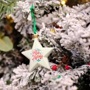Lifestyle image of the Recycled Christmas Star Baubles with a design from Total Merchandise