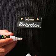 Lifestyle image of the Recycled Plastic Chalkboard Name Badge from Total Merchandise
