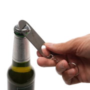 Lifestyle image of the Bimpson Bottle Opener Keyring in Silver engraved with your logo