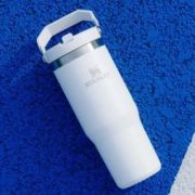 Lifestyle image of the Stanley 890ml IceFlow™ Flip Straw Tumbler with a design from Total Merchandise