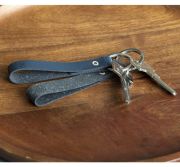 Lifestyle image of the Recycled Leather Keyrings with a design from Total Merchandise