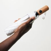 Lifestyle image of the rPET Wood Mini Auto Open Umbrella with a design from Total Merchandise