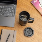 Lifestyle image of the 490ml Ceramic Luxe Quencher Tumbler in Black from Total Merchandise