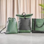 Lifestyle image of the rPET Polyester Drawstring Backpack in Green printed with your company logo