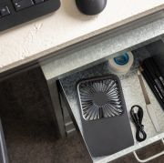 Lifestyle image of the Recycled Plastic Rechargable Desk Fan with a design  from Total Merchandise