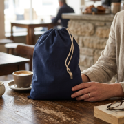 Lifestyle image of the Extra Small Cotton Stuff Drawstring Bag branded by Total merchandise