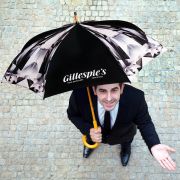 Lifestyle image of the Spectrum City Club Umbrella from Total Merchandise