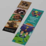 Lifestyle image of the Laminate Card Bookmark with a design from Total Merchandise