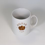 Lifestyle image of the Maxi Print Full Colour Mugs with a design from Total Merchandise
