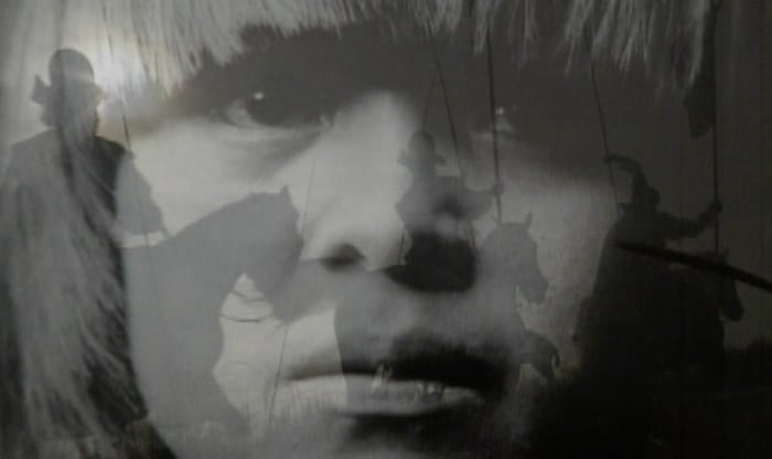 A still image from the film Surviving Columbus
