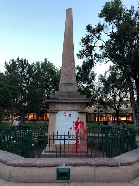 an image of red hand prints on the Obelisk