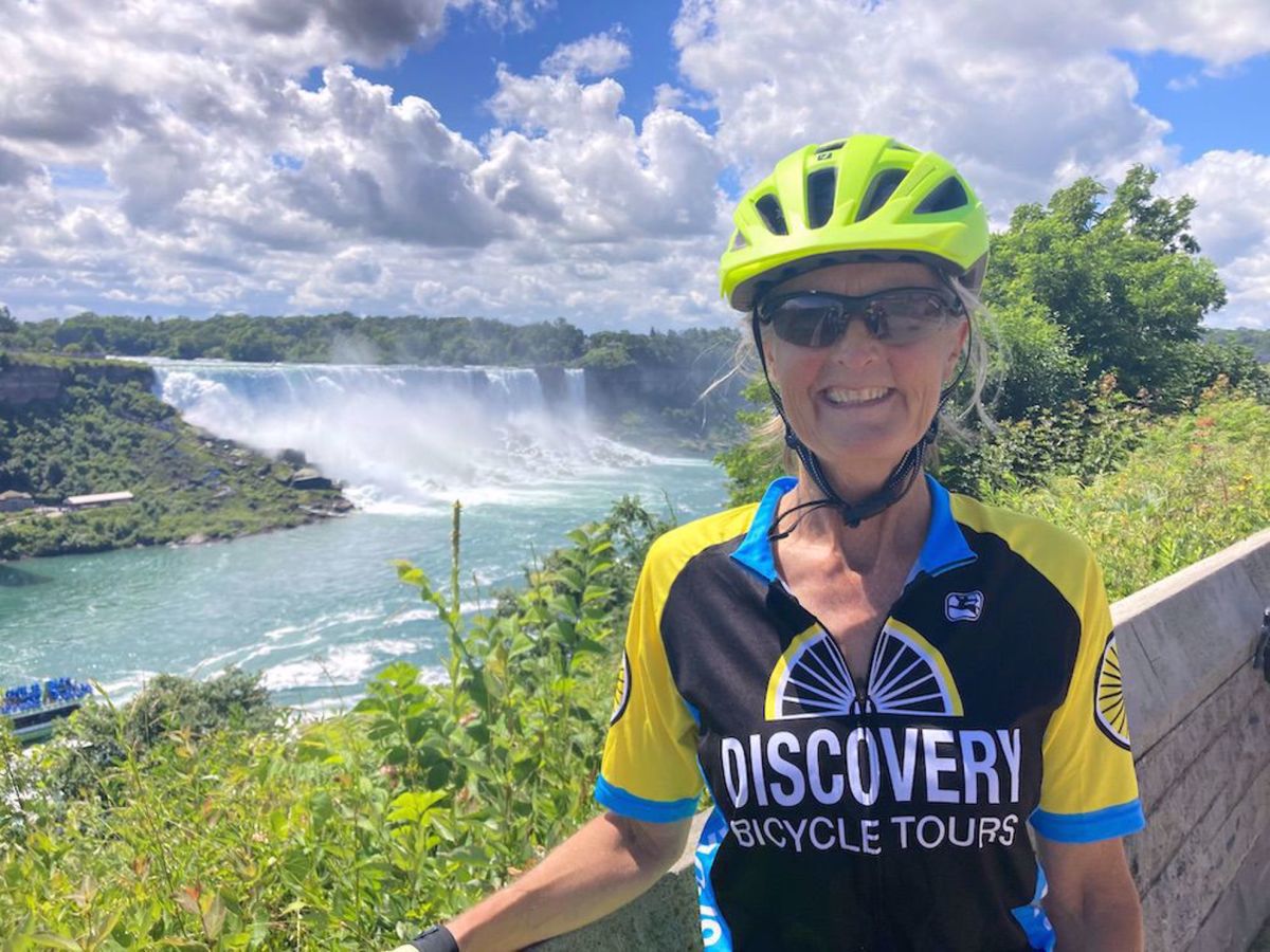 Niagara Falls & Vineyard Bike Tour Leader with view of falls