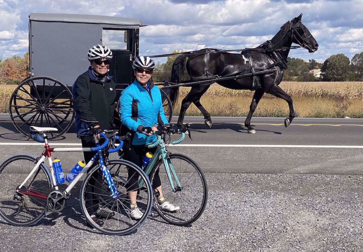 NY Finger Lakes Bike Tour On road next to horse and carriage