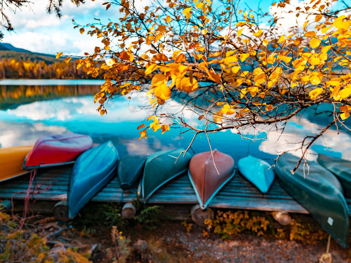 Boats lined up, fall colours New Hampshire Getaway Bike Tour