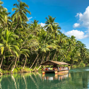 Bohol Tour: Bohol Traditional raft boat on a jungle green river Loboc