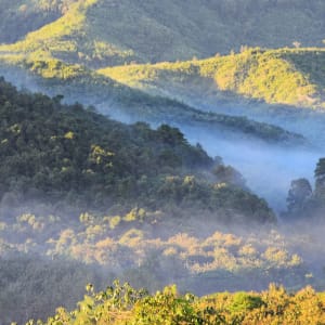 Découverte active de Luang Prabang: Landscape with mountains, fog and sunset view of the Nam Khan river