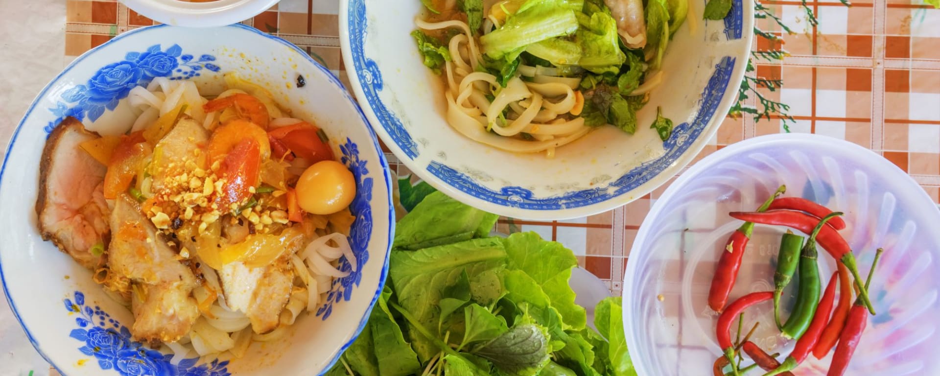 Vespa Street Food Tour in Saigon: Vietnamese noodle Mi Quang