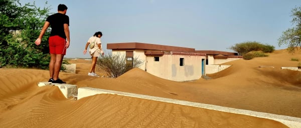 6-Hour Al Madam Ghost Village Tour with Dune Bashing and Sandboarding
