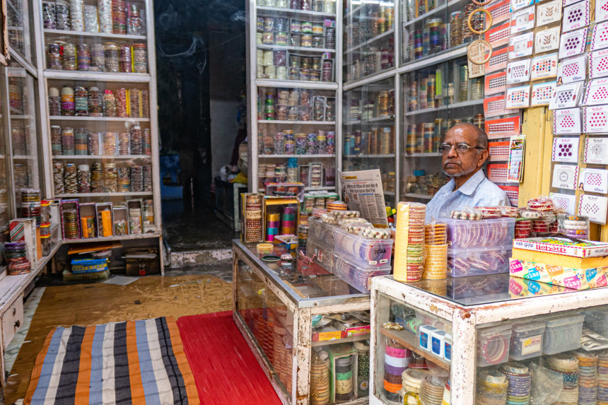 A shopkeeper selling bangles